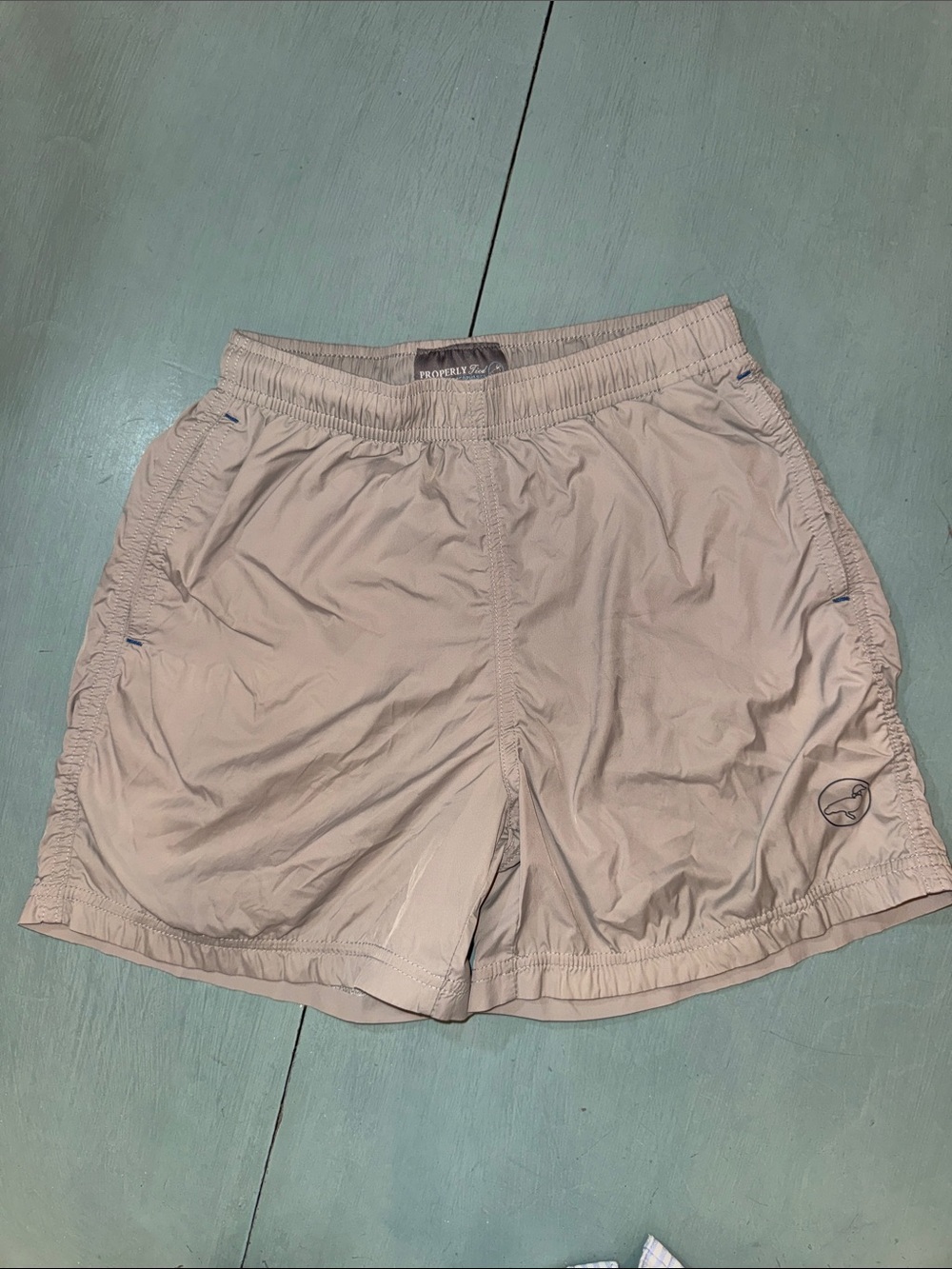 Properly tied gray athletic shorts